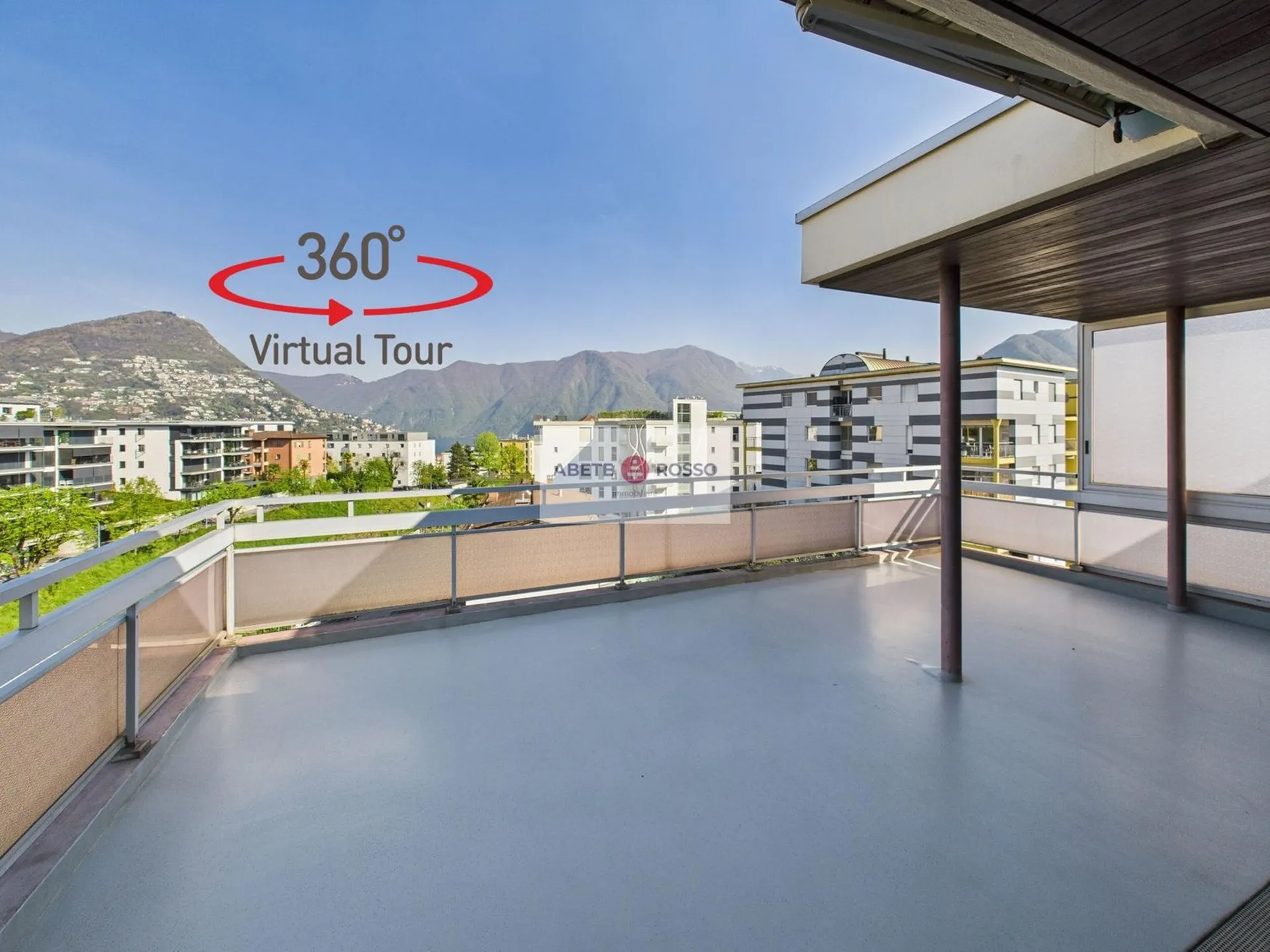 Attico con terrazzo e vista panoramica, vicino alla stazione FFS e al centro Lugano.